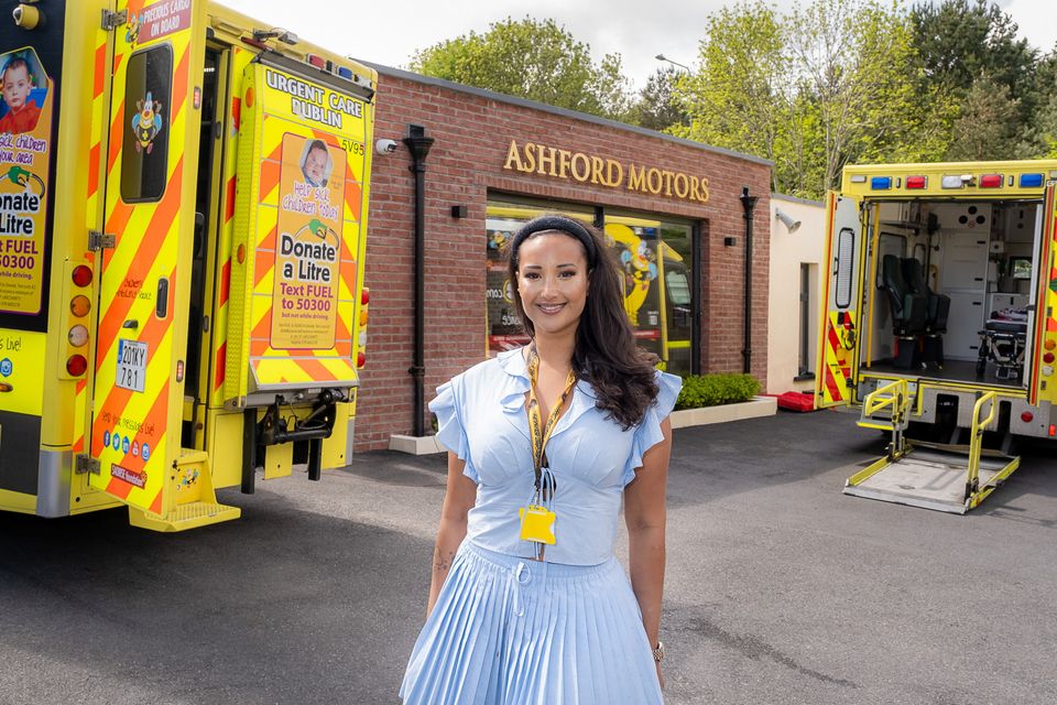 Nadia Adan outside Ashford Motors with BUMBLEance ambulances at the Bear Run charity event